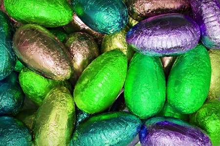 variety chocolate easter eggs wrapped in colorful neon shiny foil