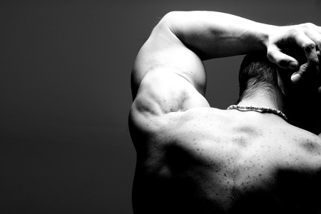 muscular male shoulder and back in black and whiteの写真素材