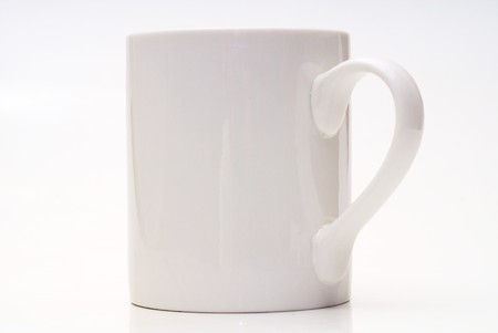 White cup with the tea with the milk