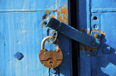 Old lock on the shabby wallの写真素材