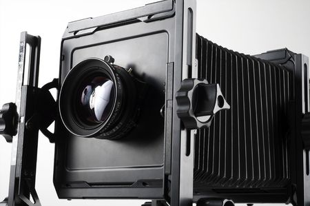 Large format camera front taken from the side.