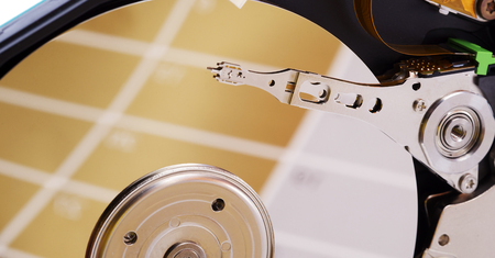 Close-up inside view of hard disk isolated on white background