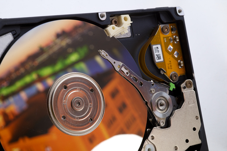 Close-up inside view of hard disk isolated on white background