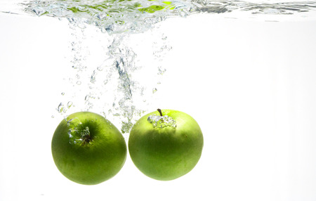 A series, green apples in waterの写真素材
