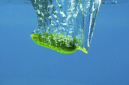 A series, vegetables in water on a dark blue backgroundの写真素材
