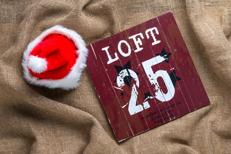 Santa cap on natural sackcloth background