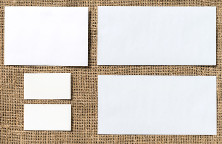 Mock up of business stuff on wooden board.