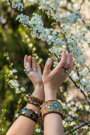 Fashion shot of a beautiful boho style girl on nature background. Boho, hippie.の写真素材