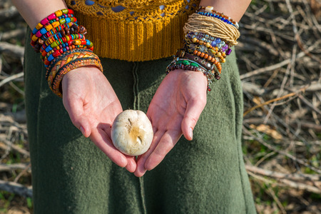 Fashion shot of a beautiful boho style girl on nature background. Boho, hippie.