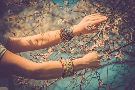 Fashion shot of a beautiful boho style girl on nature background. Boho, hippie.