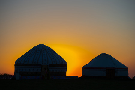 Yurta - traditional nomadic house, Central Asia. Sunset view.の写真素材