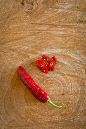 Red chilli pepper on a wooden backgroundの写真素材