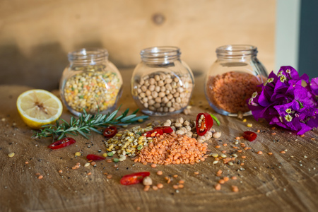 Raw cereals set on wooden background.の写真素材