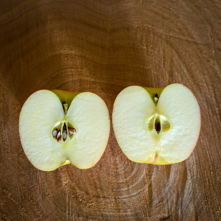 Fresh red apples on a wooden backgroundの写真素材