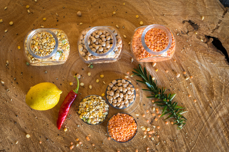 Raw cereals set on wooden background.の写真素材