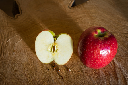 Fresh red apples on a wooden background