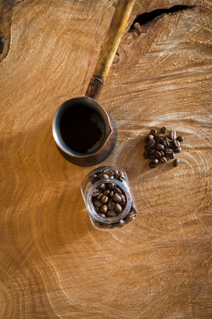 Coffee beans on a wooden tableの写真素材
