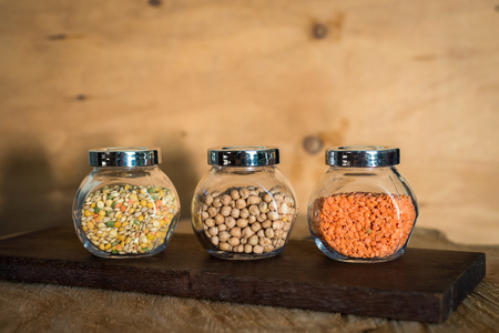 Raw cereals set on wooden background.の写真素材