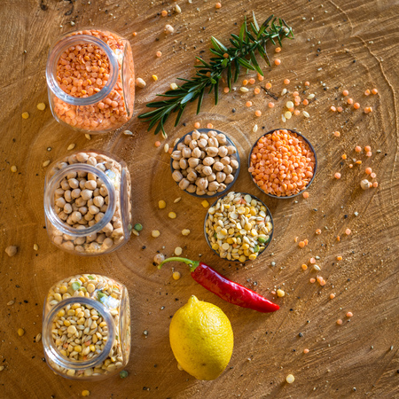 Raw cereals set on wooden background.の写真素材
