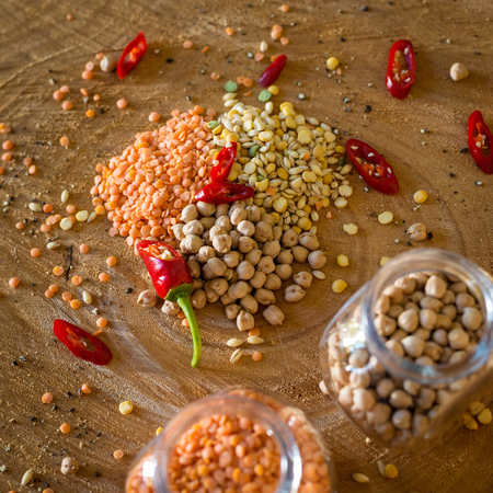 Raw cereals set on wooden background.の写真素材