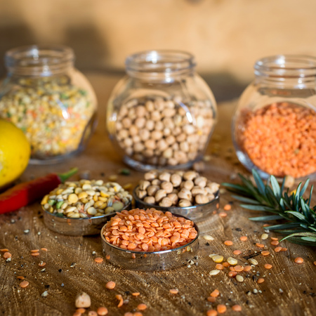 Raw cereals set on wooden background.の写真素材