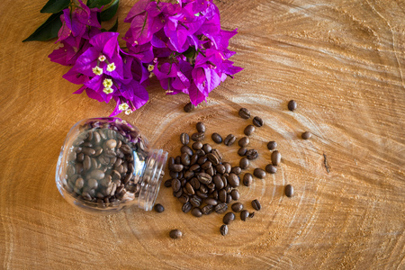 Coffee beans on a wooden tableの写真素材