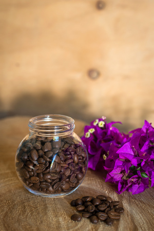 Coffee beans on a wooden tableの写真素材
