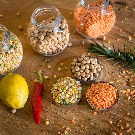 Raw cereals set on wooden background.の写真素材