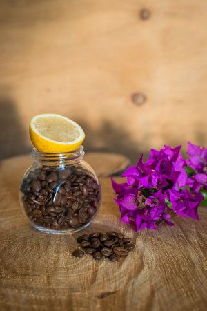 Coffee beans on a wooden tableの写真素材