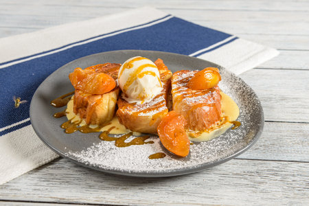 Peaches and Cream is a luscious dessert or breakfast dish featuring ripe, juicy peaches served with a dollop of rich whipped creamの写真素材