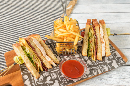 A Club Sandwich is a classic American dish made with three slices of toasted bread layered with sliced turkey or chickenの写真素材