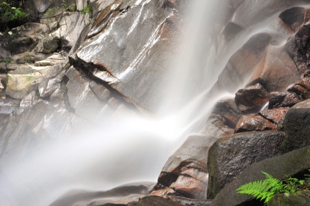 Rapid water at tropical waterfall in Malaysiaの写真素材
