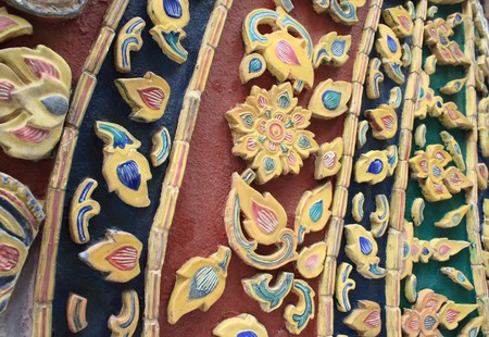 ancient ceramic tiles on walls of Wat Phra Kaew in Bangkok, Thailandの写真素材