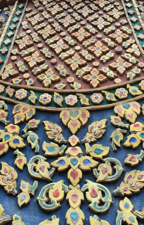 ancient ceramic tiles on walls of Wat Phra Kaew in Bangkok, Thailand