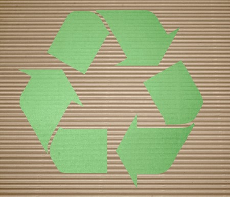 green recycling on corrugated cardboard with backgroundの写真素材