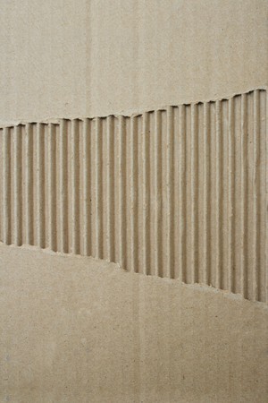 Brown corrugated cardboard with backgroundの写真素材