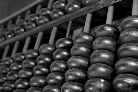 Old wooden abacus on whiteの写真素材