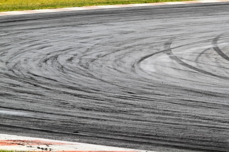 Background with tire marks on road trackの写真素材