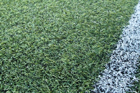 Green artificial grass soccer field for backgroundの写真素材