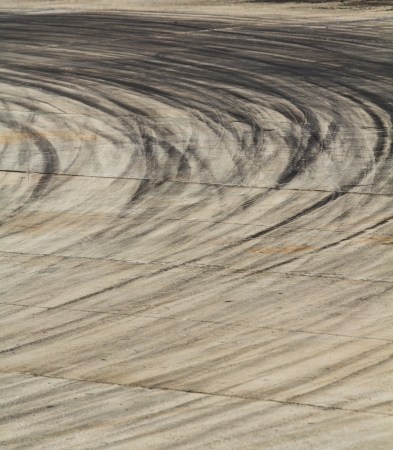 Background with tire marks on road trackの写真素材
