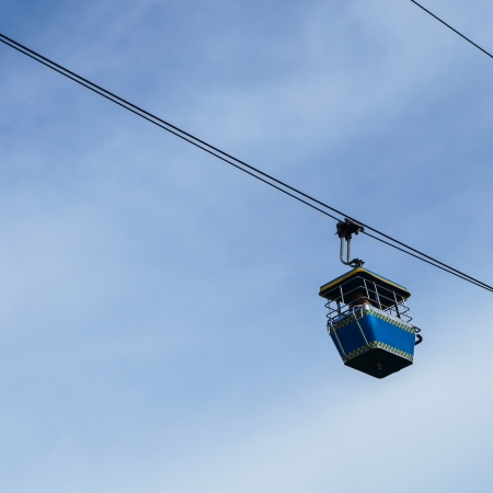 Cable car on the blue sky backgroundの写真素材