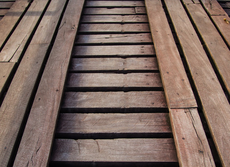 The old wooden bridge across the riverの写真素材
