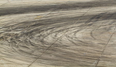 Background with tire marks on road trackの写真素材