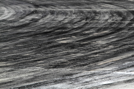 Background with tire marks on road trackの写真素材