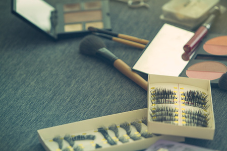 Cosmetic set on dressing table with vintage filter