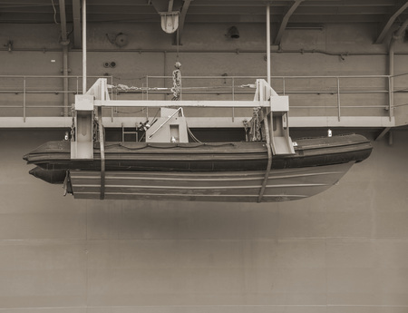 Safety lifeboat on side of shipの写真素材