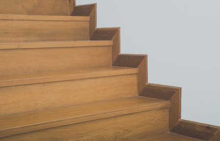 Interior with wooden staircase and white wallの写真素材
