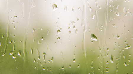 Rain water drop on glass of windowの写真素材