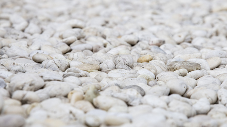 White pile of pebble stones backgroundの写真素材