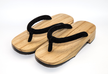 wooden Japanese sandals isolated on white backgroundの写真素材